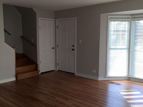living room / front door / hall closet / stairway