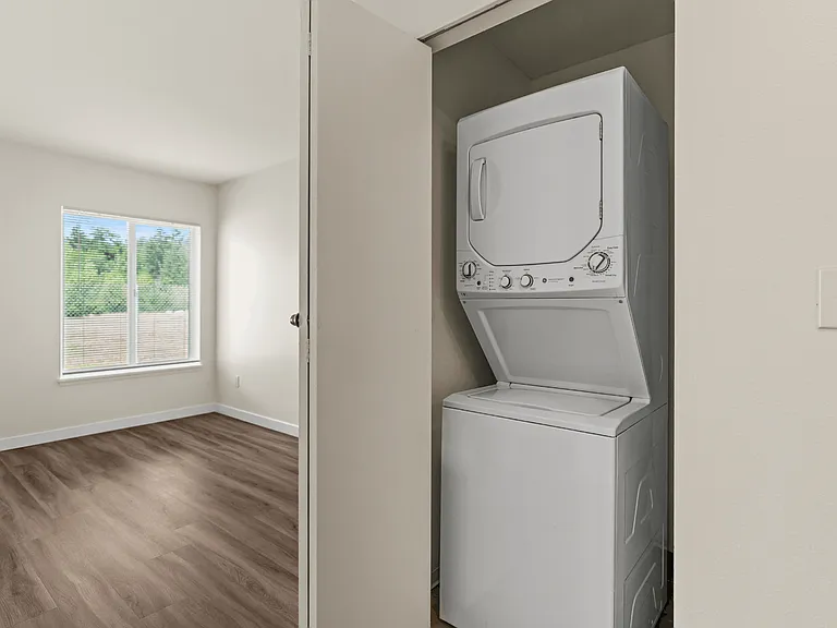 Convenient in-home washer and dryer paired with modern finishes and a bright, open apartment layout. Convenient in-home washer and dryer paired with modern finishes and a bright, open apartment layout.