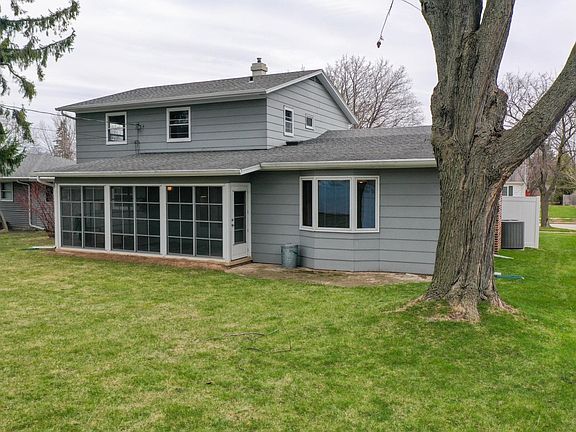 VIEW OF THE BACKSIDE OF THE HOME