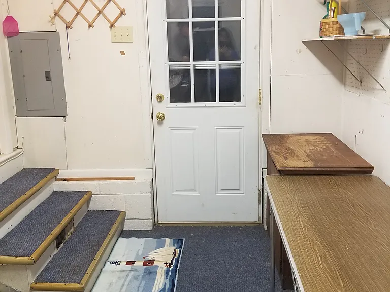 Laundry room.
Tables will be removed prior to move in.
Door leads to backyard.