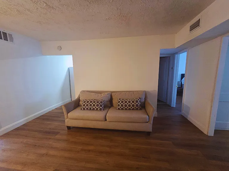 Spacious and sun-filled living area designed for comfort and relaxation.