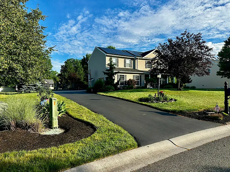 Long driveway to 2 car garage. Plenty of space for multiple cars.