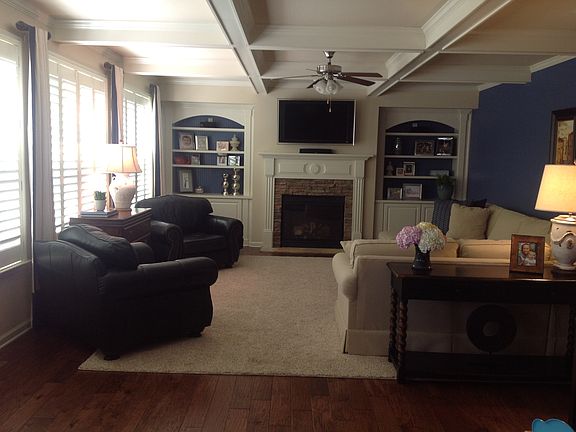 Extended family room with built-ins and coffered ceilings