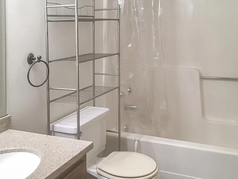 All updated upper bathroom with porcelain floor and custom glass tile trim.