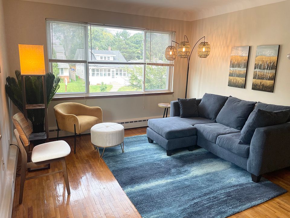 Spacious, sun-lit living room with huge picture window