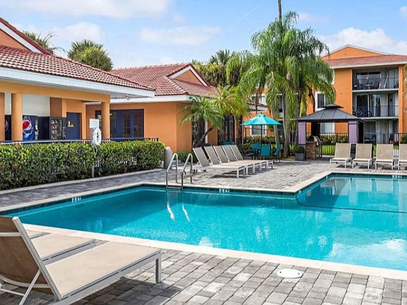 Lounge on the spacious sundeck at Midora at Woodmont in Tamarac, FL