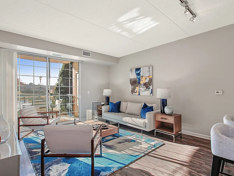 Sun-filled living room with sliding glass doors
