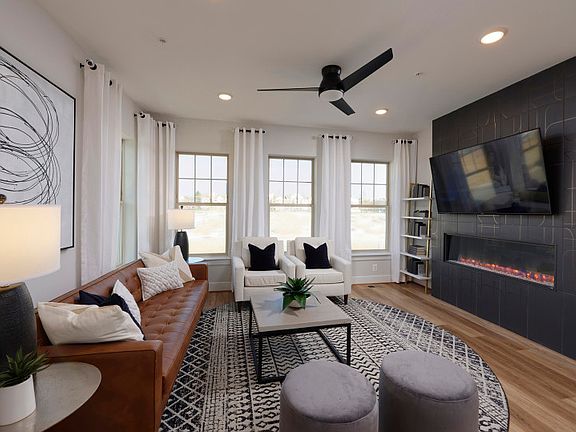 Sunlit Gathering Room Opens to the Kitchen - Model Representation