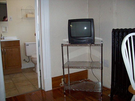 cart has shelves for tv, microwave & toaster oven