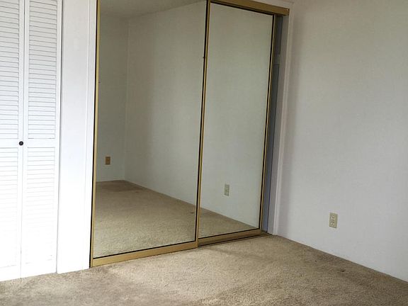 Bedroom mirror closet doors, view of mountains as living roo