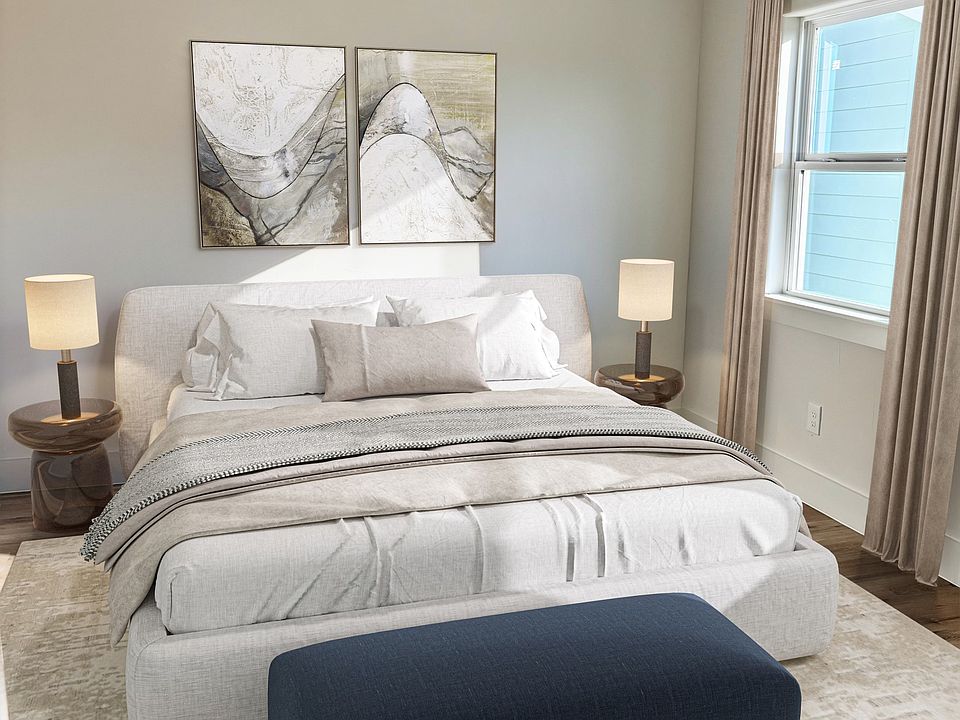 Bedroom large enough to fit a king sized bed and two side tables with ease.