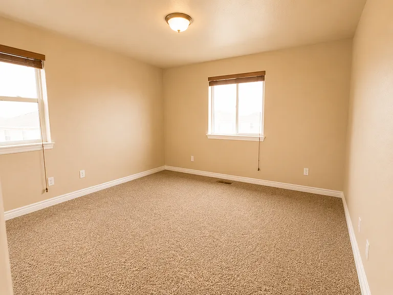 Third bedroom with two windows and good natural light.