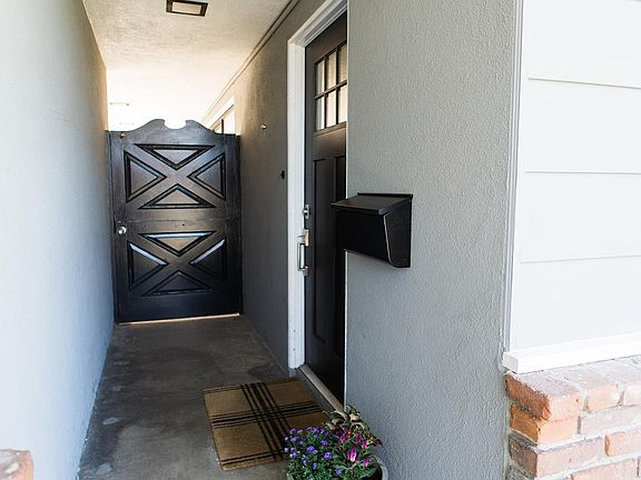 Front door. Backyard gate used by back renter for property access.