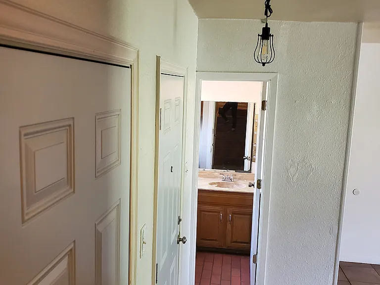 Half bathroom downstairs. Tile floor
