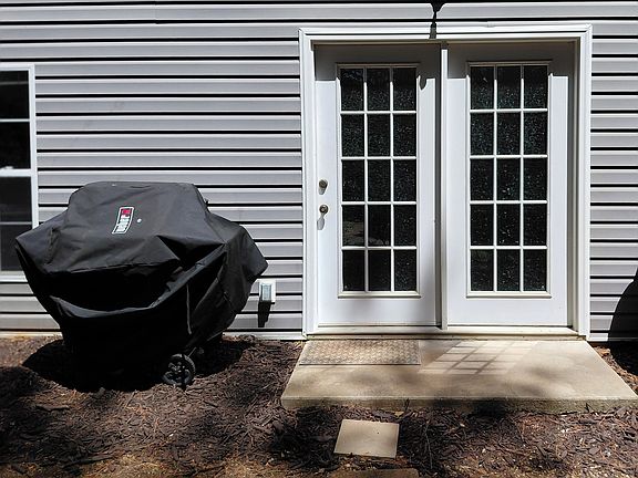 Private entrance with dedicated outdoor area and grill access