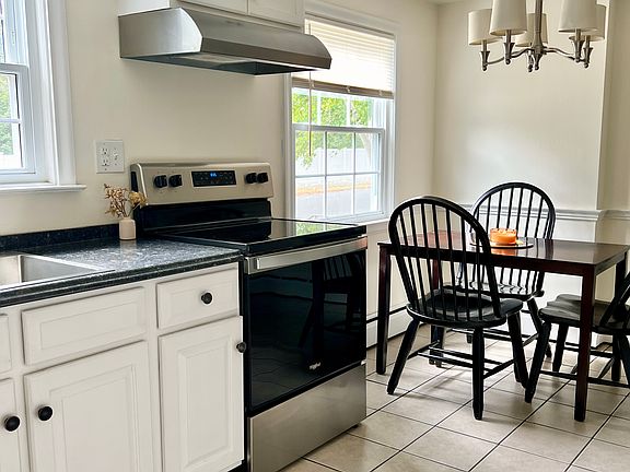 Kitchen; left side - dining area, electric stove