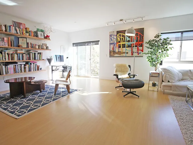 Large open living room, facing quiet and private greens on b