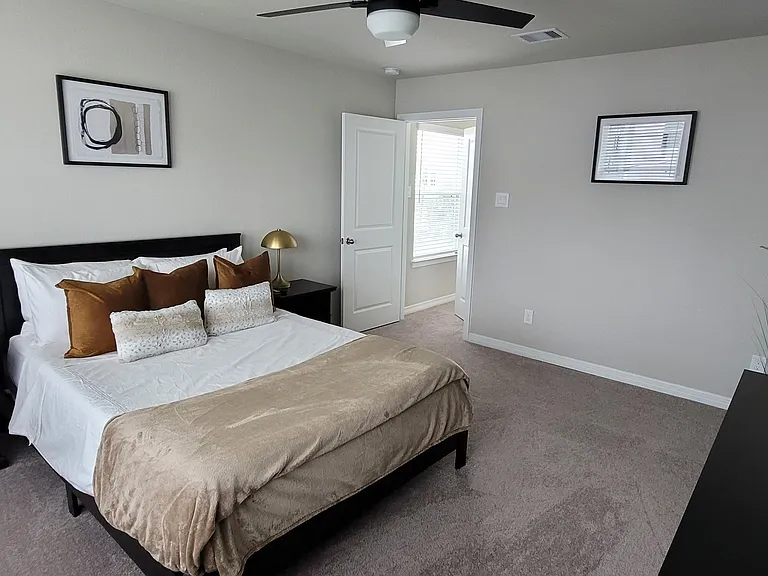 Upstairs bedroom with view of entry way