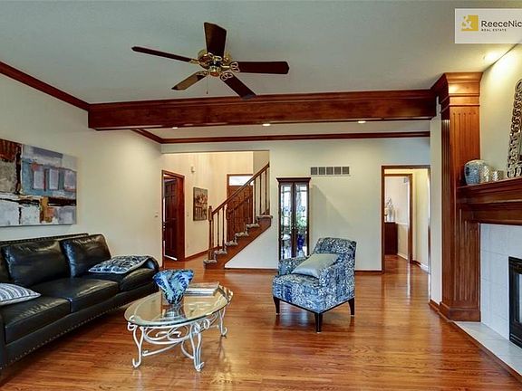 Livingroom looking on to front entrance and formal dining room. Double sided fireplace between this room and kitchen hearth room
