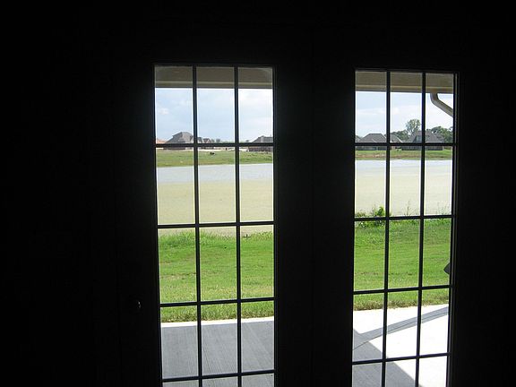 VIEW OUT OF THE PATIO FRENCH DOORS