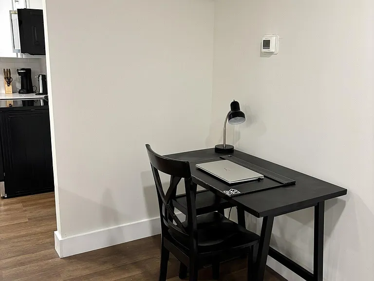 Dedicated dining nook with space for a bistro table, ideal for meals or a home office setup near the kitchen.