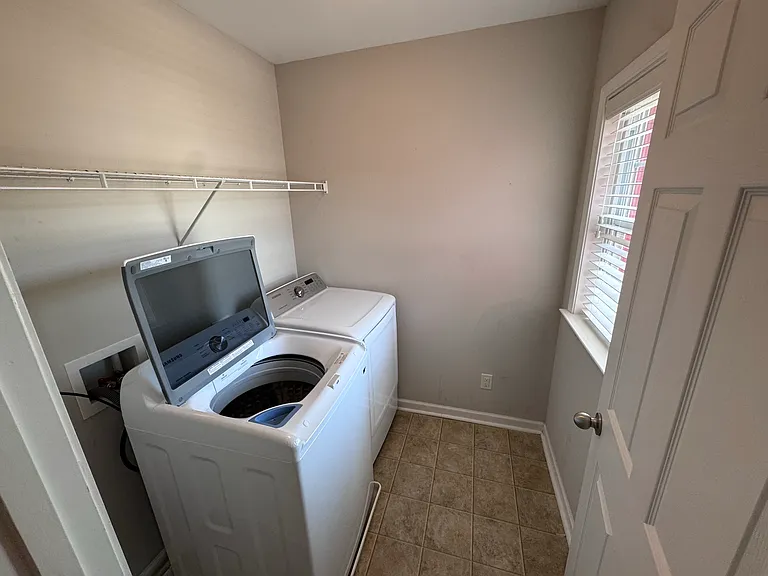 Upstairs laundry room.