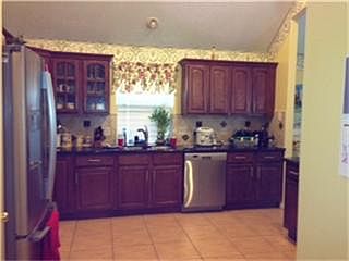 SPACIOUS KITCHEN W/ NEW GRANITE COUNTER TOP & CABINET