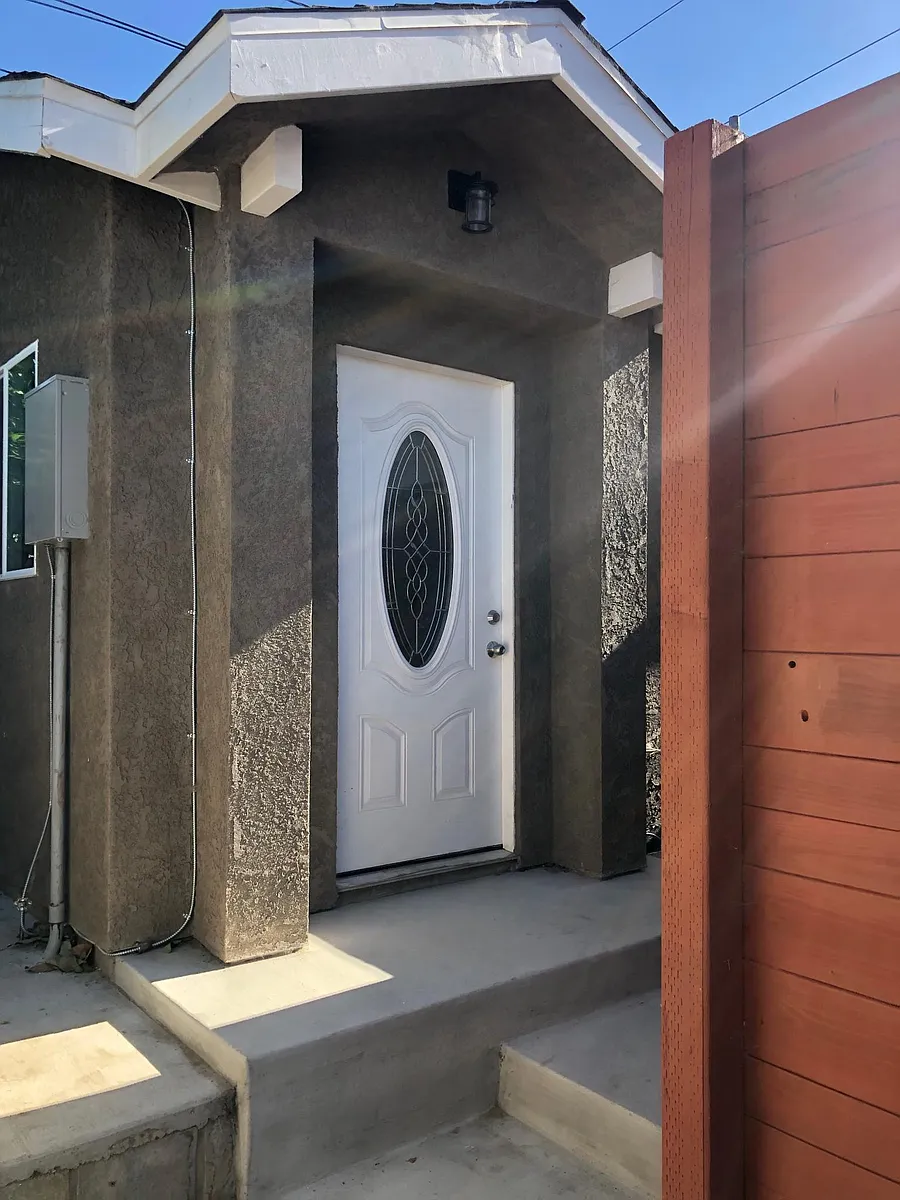Front with gate. - 5036 1/2 W 137th Pl