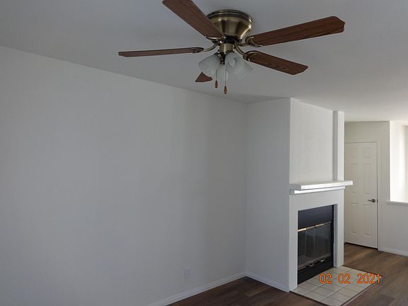 Taken from dining area with fireplace and coat closet beyond.