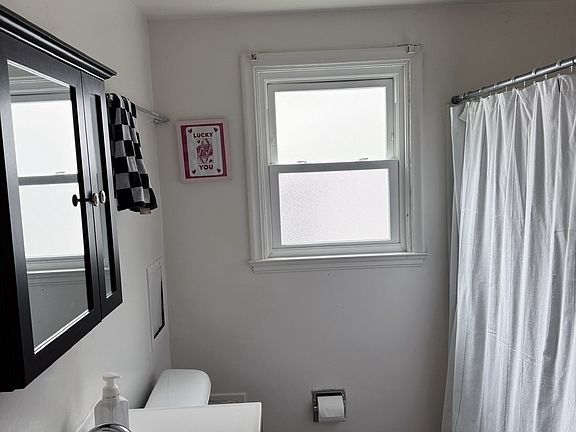 bathroom has a storage closet