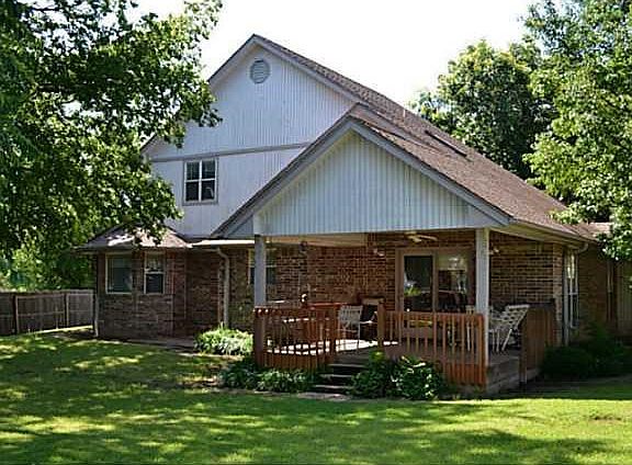 Exterior Back. Privacy and shade are abundant in the large back yard.
