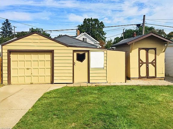 Single car garage with heater, 220 electrical, & workshop + shed for storage!