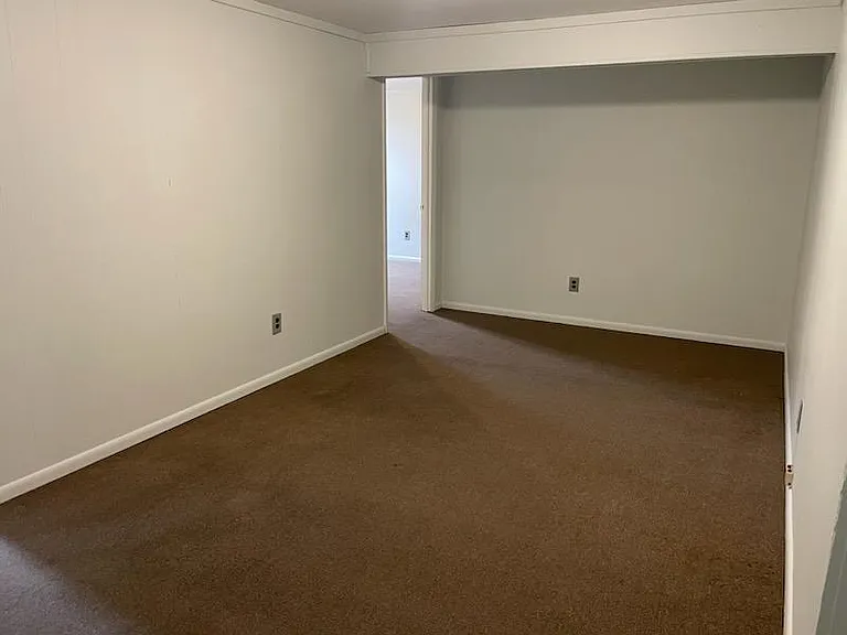 View of living room. Door on left is bedroom