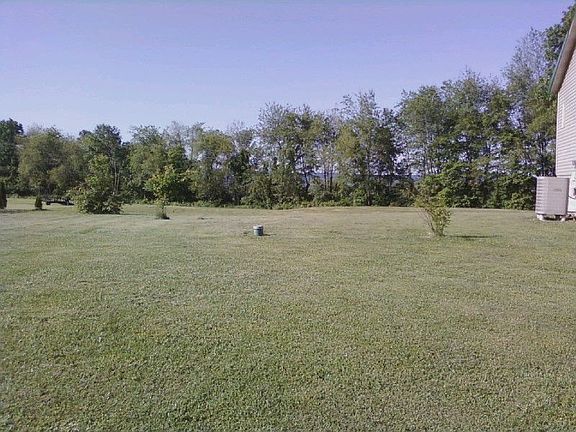 Yard to the left of house