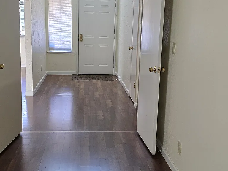 double door bedroom with view of front entrance