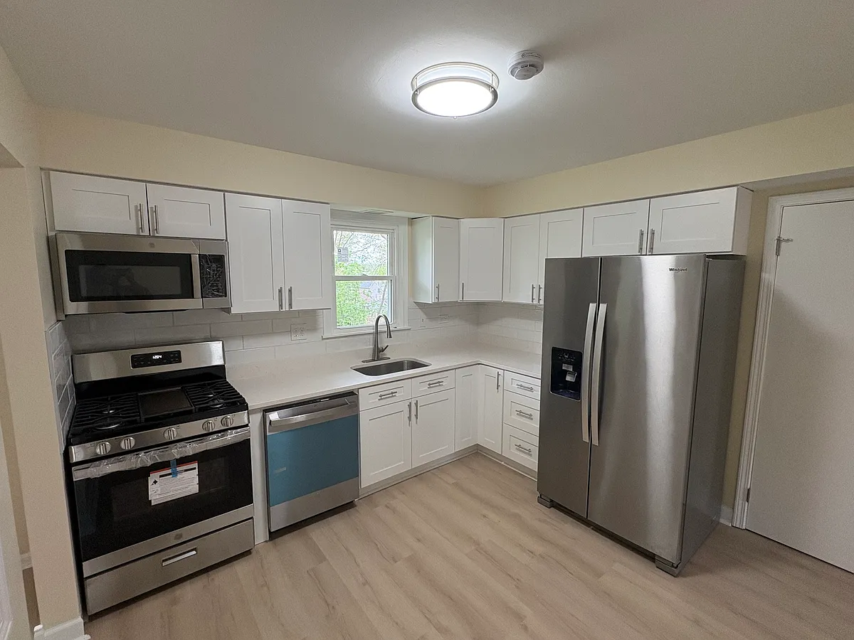 Fully remodeled kitchen, new shaker cabinets, new stainless steel appliances, quartz countertops, luxury vinyl panel floors - 5112 Main St