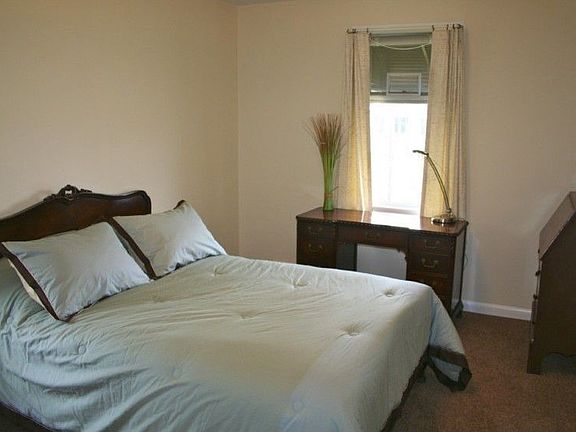 The master bedroom is located on the main level of the home and is sunny and cheerful.