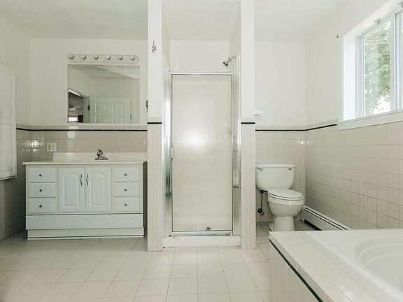 Bathroom with stand up shower and large Jacuzzi Tub