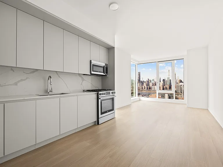 Welcome to Aura, where modern living meets stunning views. This spacious kitchen and bright living area create the perfect backdrop for your lifestyle. Don't miss your chance to call this beautiful space homeAE'AAAAAaAAAAAAaAAAcontact us today!