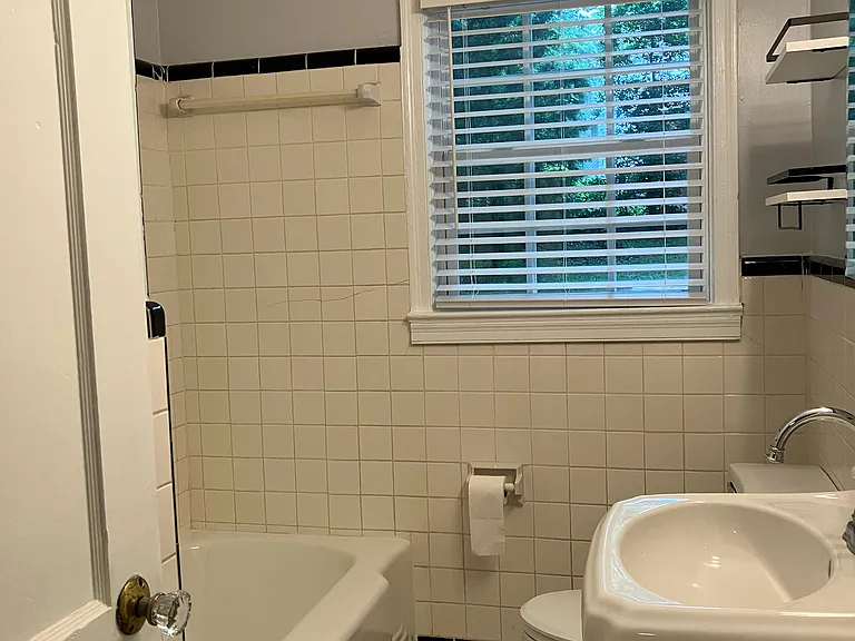 Bathroom with bathtub and shower