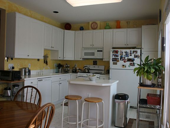 Upgraded cabinets and corian countertops