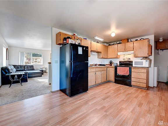 The kitchen offers ample cabinet space and easy care flooring. 