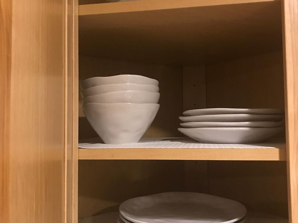 New dishes stored in cabinets