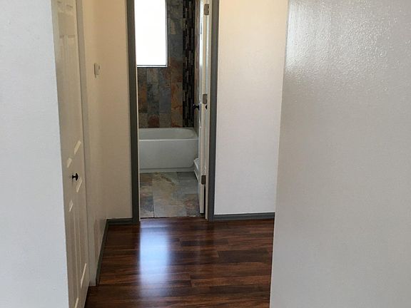 Hallway to rooms and bathroom(closet to the left)