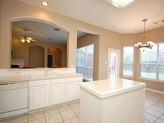 Kitchen opens to family room with large breakfast room.