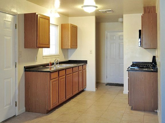 Laundry area at back of kitchen. Between Kitchen/Back door