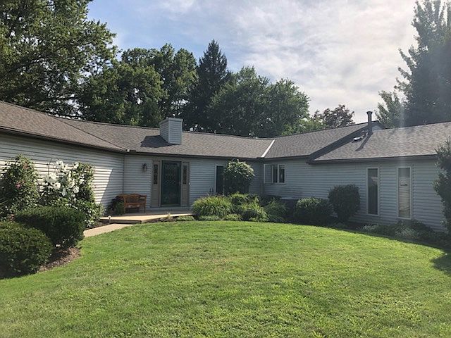 Front of home faces Rudy Dr