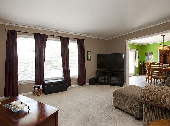 Formal living opens to formal dining room