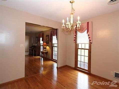 Generous sized formal dining room with chandelier adjoins the kitchen & living room.
