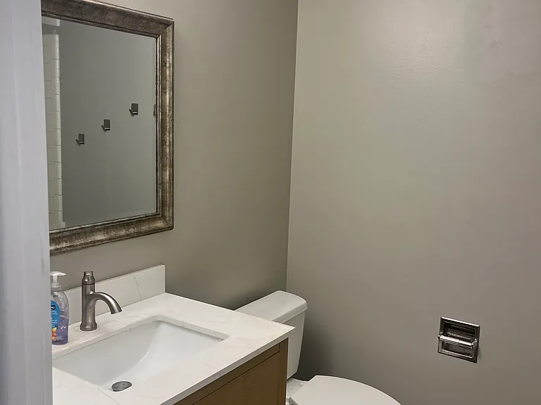 Main level bathroom with shower and tub.